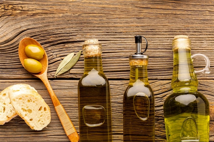 three glass bottles of olive oil